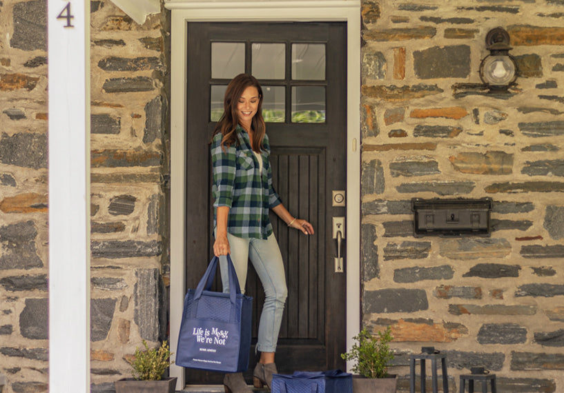 Customer Picking up Home Appétit Meal Delivery at Front Door
